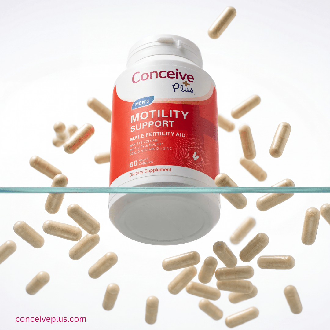 Supplement bottle labeled 'Conceive Plus Motility Support' with scattered capsules on a white background.
